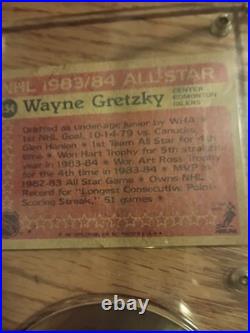 1983-84 Allstar Wayne Gretzky Hockey Card With A Signed Hockey Puck